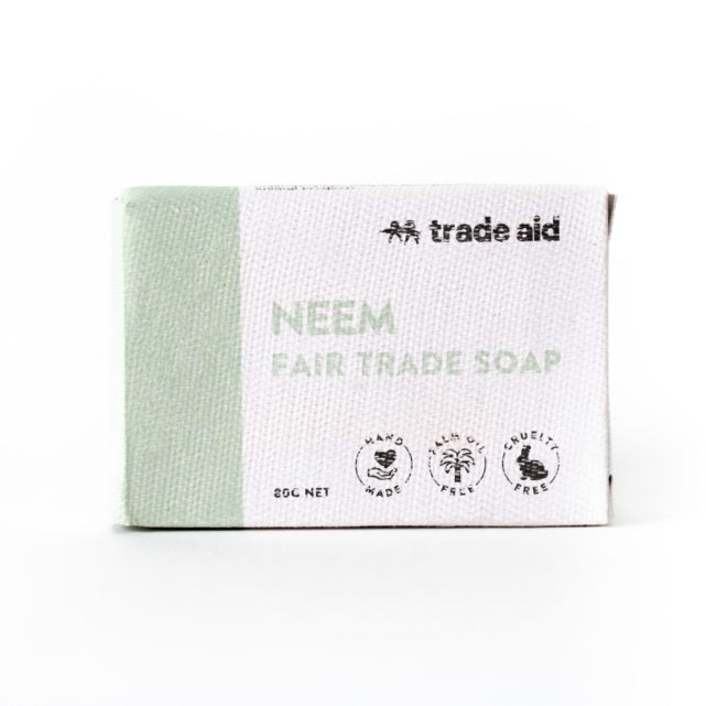 Neem Fair Trade Soap packaging with 'Trade Aid' branding on a white background