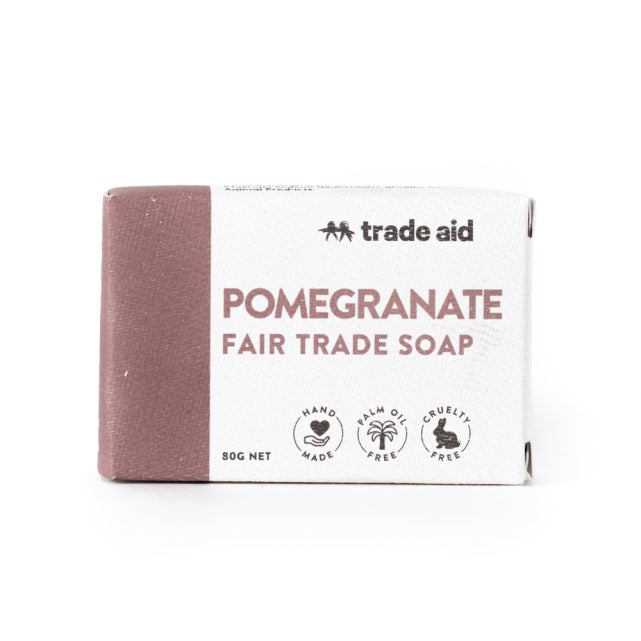 Pomegranate fair trade soap bar with packaging on a white background