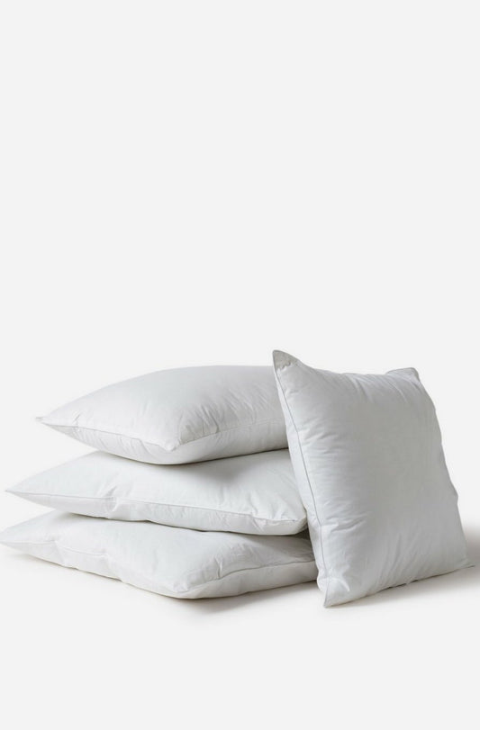 3 Città Design Microfibre Cushion Inners Stacked with a 4th inner leaning against the stack on a white background