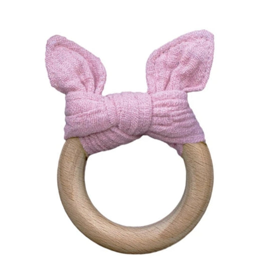 linen baby teether on wooden ring, with pink cat ears on a white background