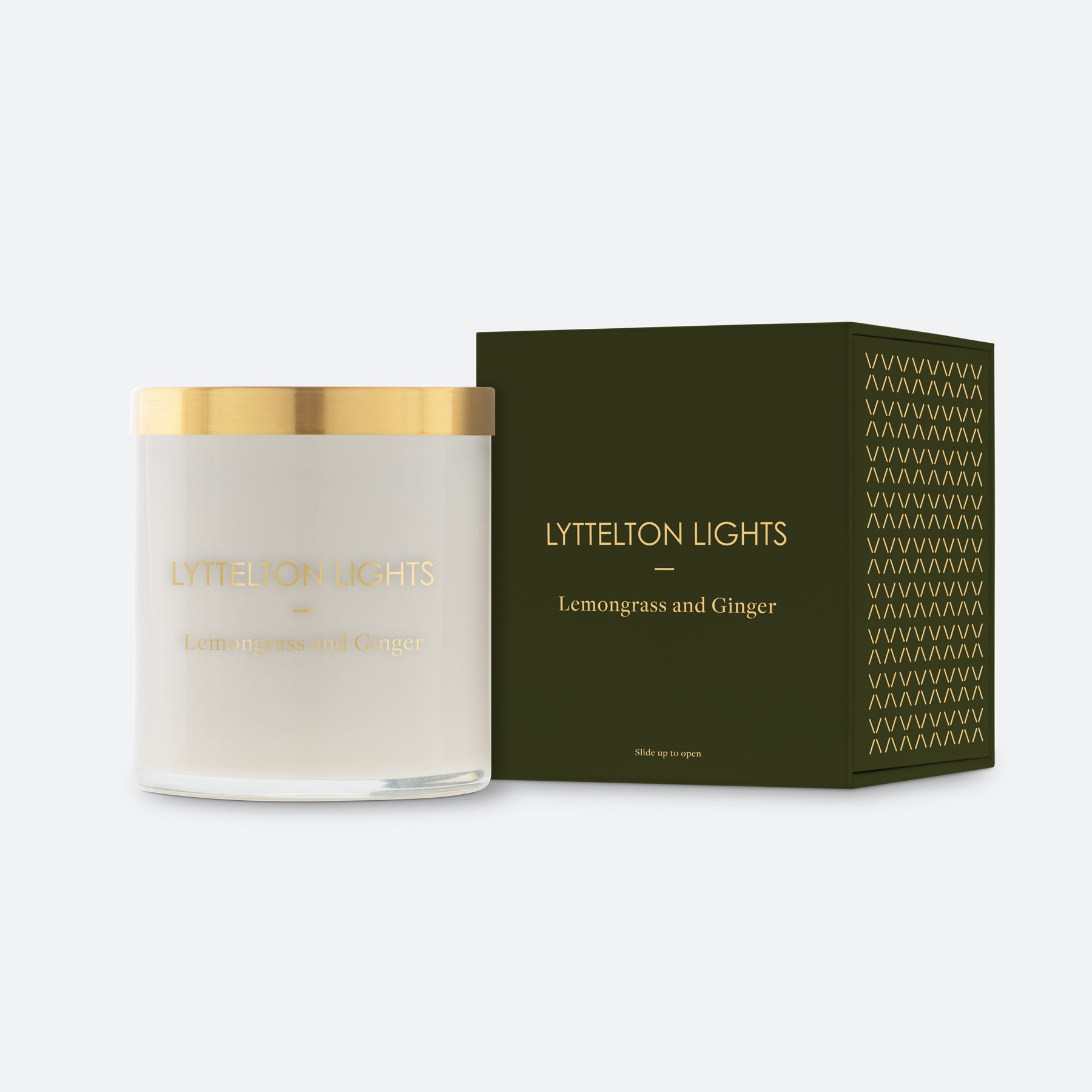 Lyttelton Lights Lemongrass and Ginger candle with gold lid and matching forest green packaging on a white background