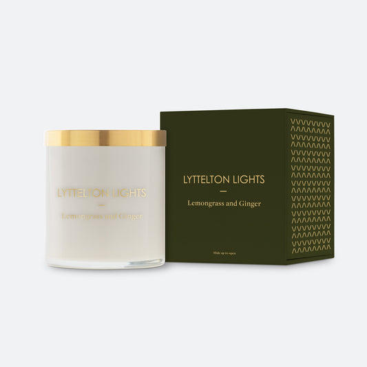 Lyttelton Lights Lemongrass and Ginger candle with gold lid and matching forest green packaging on a white background