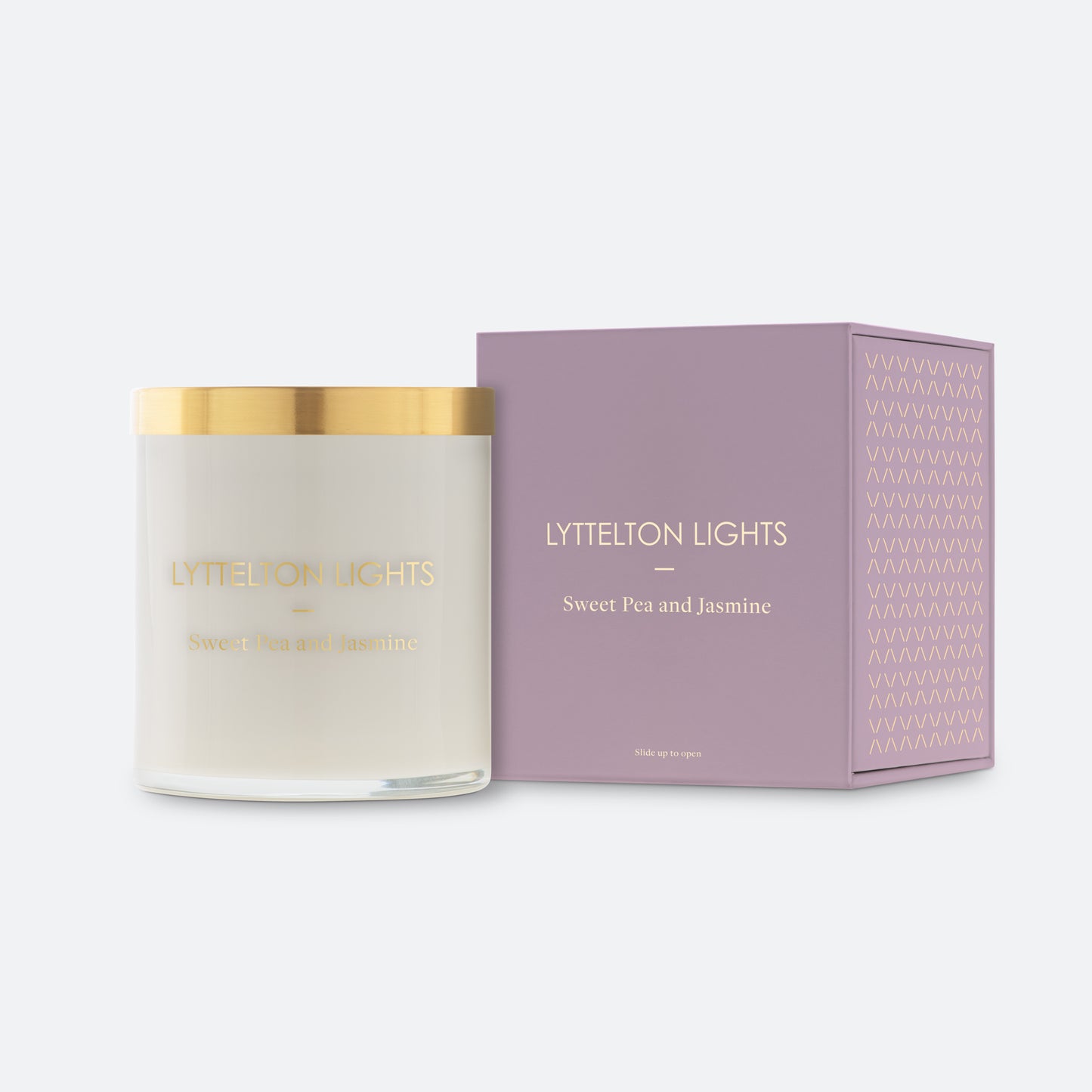 Lyttelton Lights Sweet Pea and Jasmine candle with gold lid and matching mauve packaging on a white background
