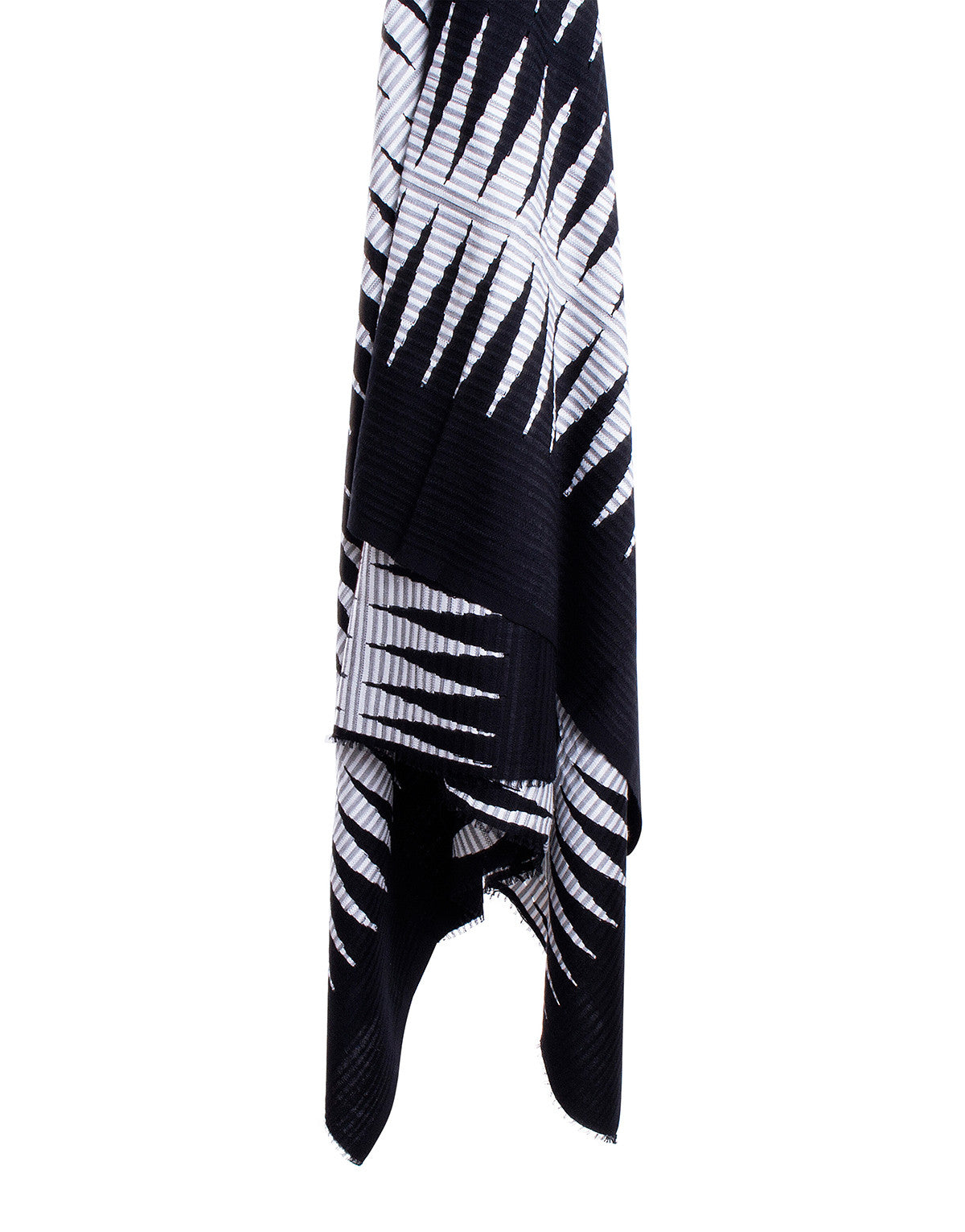 A black and white handwoven cotton throw with a geometric pattern, displayed against a white background.