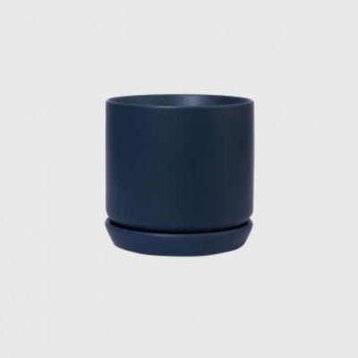 Muted Navy coloured pot plant with saucer on a white background