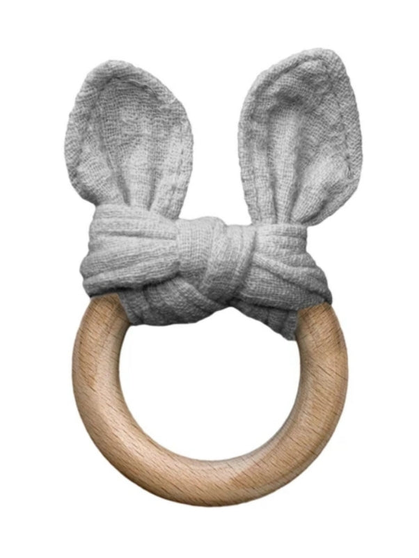 grey bunny teether on a wooden ring on a white background with grey linen bunny ears